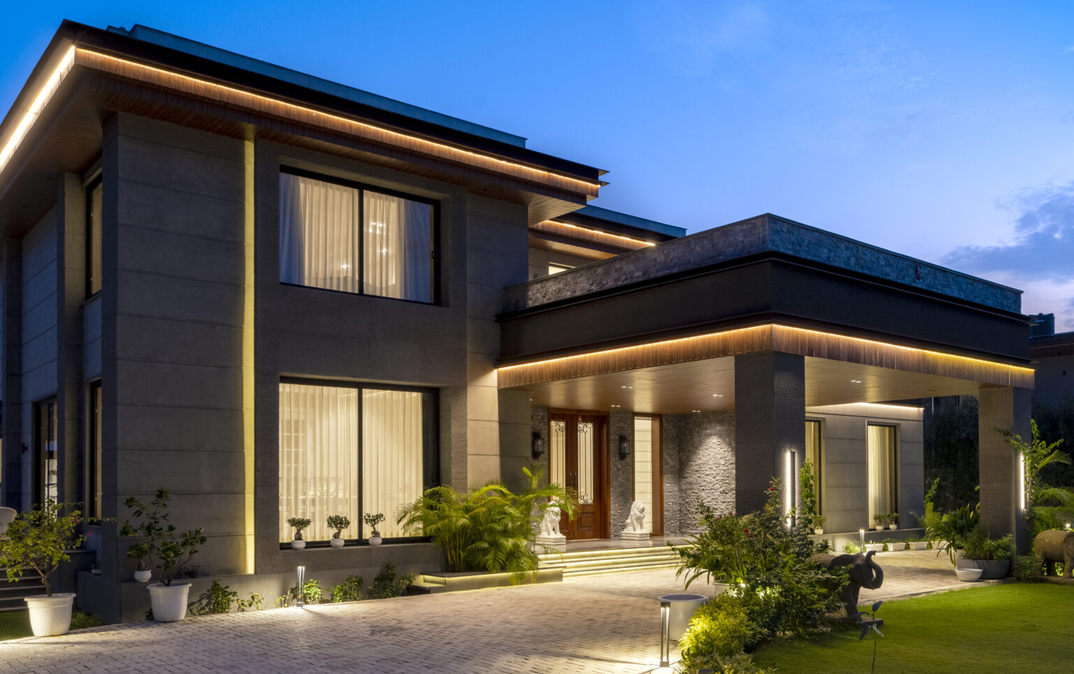 Twilight view of a private residence designed by Pochē Aesthetics