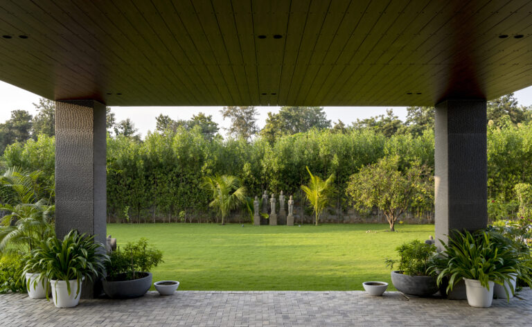 View of the front garden from the main entrance — interior design by Pochē Aesthetics, Delhi NCR