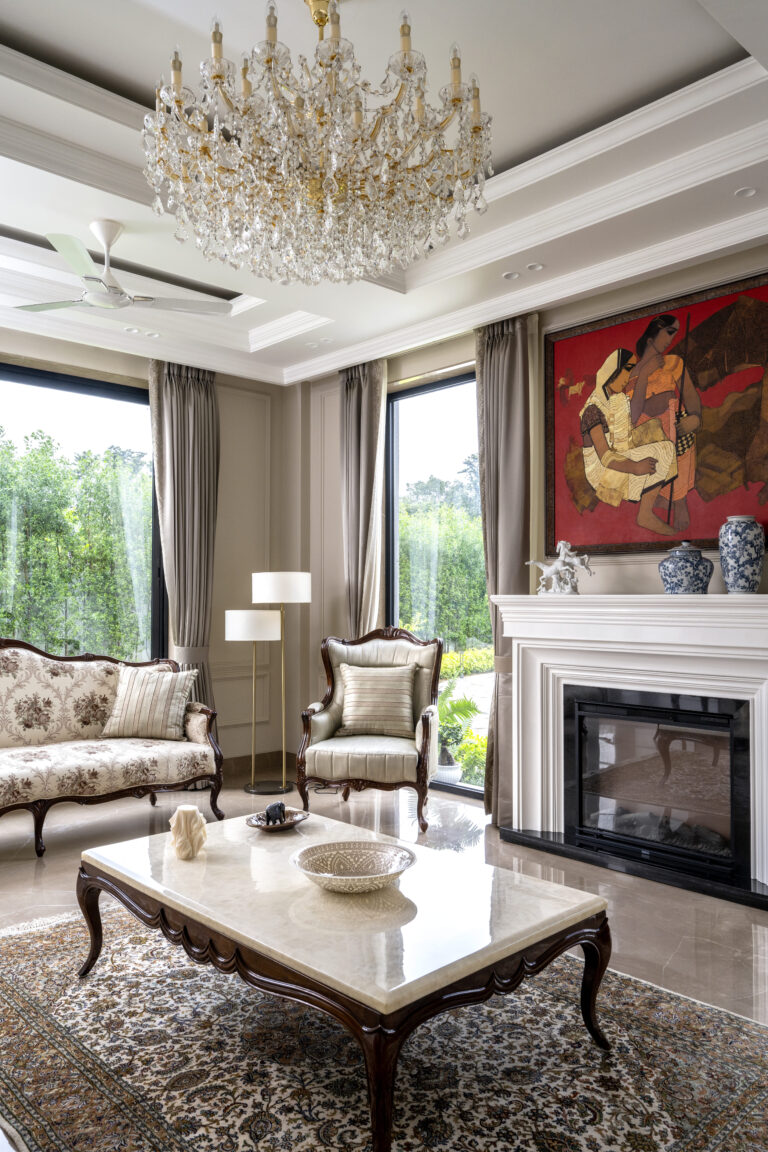View of the drawing room with fireplace — interior design by Pochē Aesthetics, Delhi NCR
